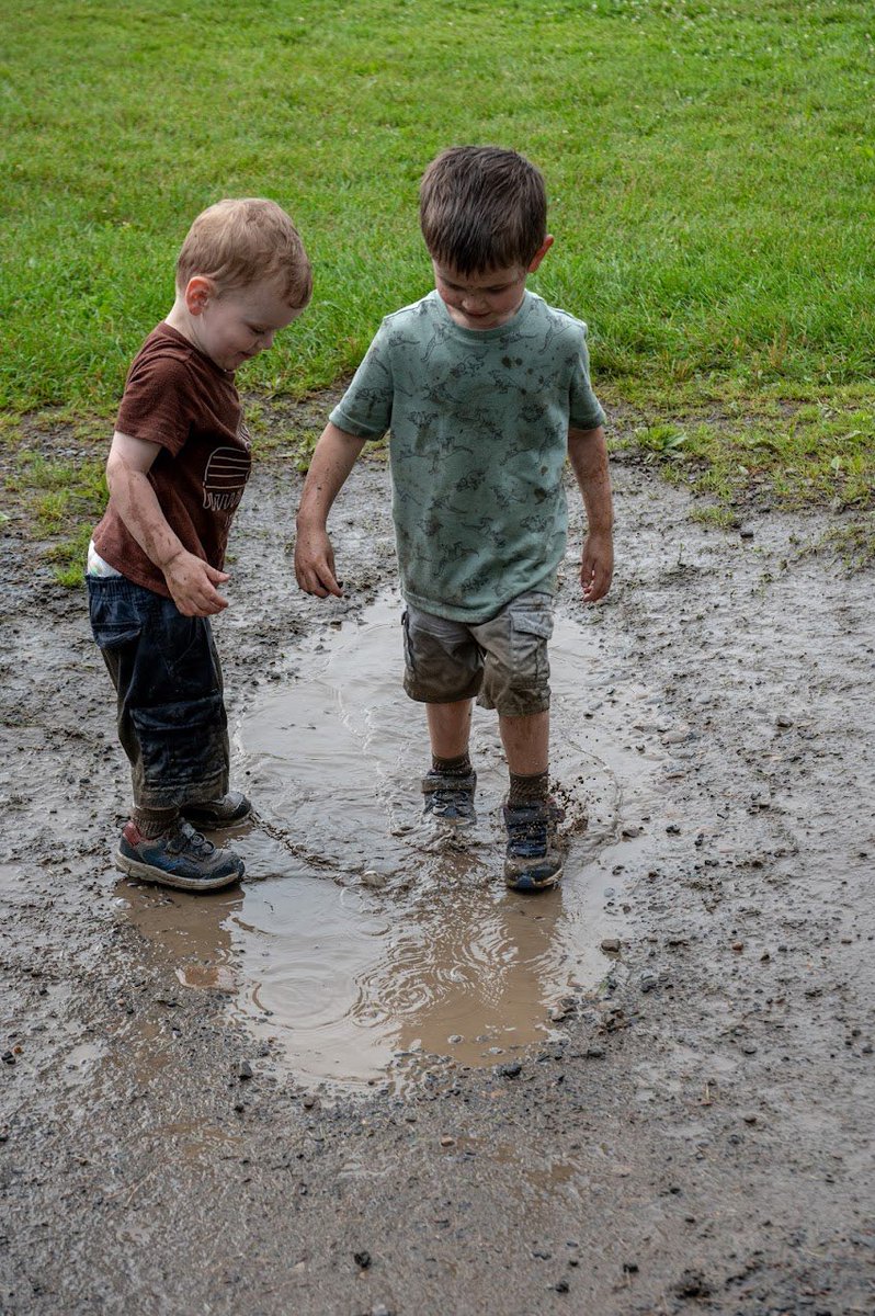CatholicLand's tweet photo. Who needs phones and electronic toys when you have a puddle of mud? Two boys enjoyed themselves at the Conference. Something for everyone! https://t.co/Ch4ko1r7pD