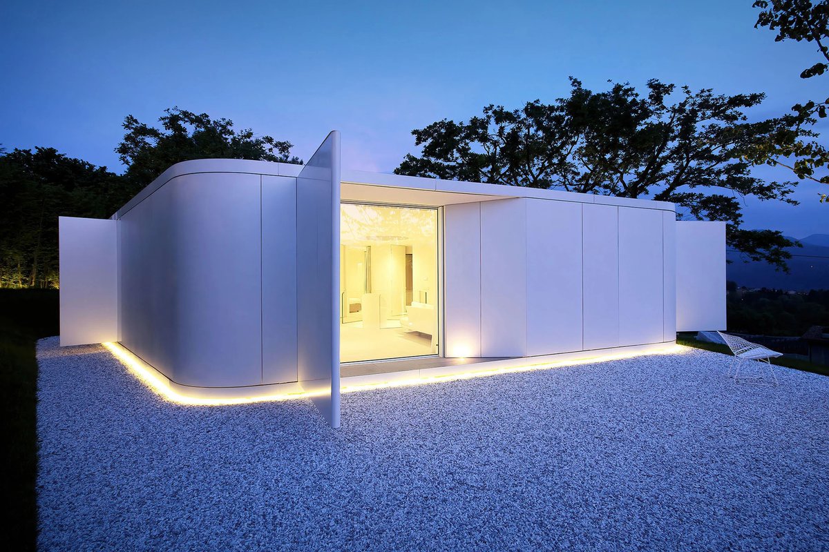 Pinwheel house by JM Architecture resembles "a white pebble in the landscape": dezeen.com/2023/07/04/pin…