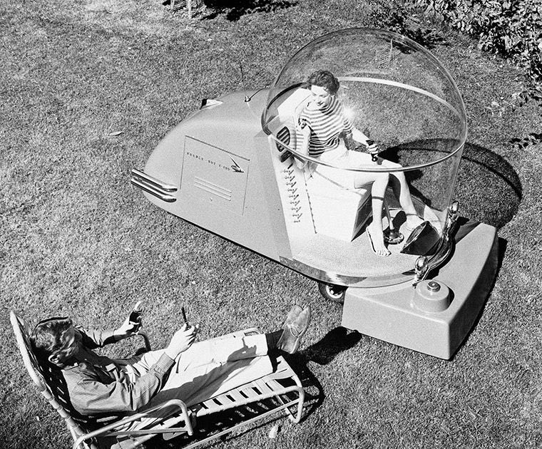 The 'Power Mower of the Future,' an air-conditioned lawnmower, was advertised in October 1957 as a revolutionary piece of lawn mowing equipment. This innovative machine incorporated a unique design, featuring a large plastic sphere with a five-foot diameter. The rider would sit