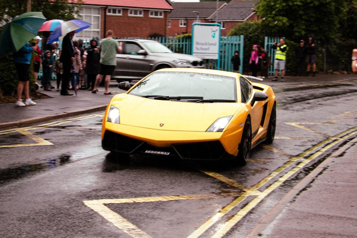 BrecklandSchool's tweet photo. Our Year 11 prom set off in style with a convoy of super cars leaving Breckland School heading for @hockwoldhalluk Thank you to all those that have supported us and also braved the rain! https://t.co/M69oNESUdH