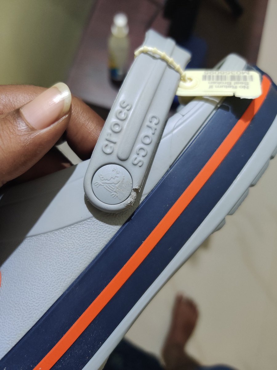 Mundari17's tweet photo. @myntra Regarding my recent order "unisex grey crocband clogs". I have received a damaged product, yet while returning the product under the "damaged product" category, the pick up agents have refused to pick up the product stating it's damaged. Issue registered yet no solution. https://t.co/NcmOGICEn7