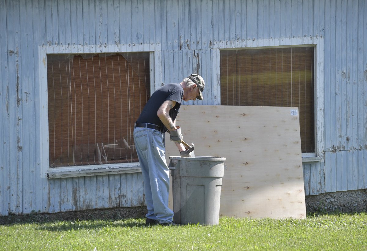 Bruce Deck cleans up a glass window that was blown out of his barn at the corner of Hossler and Colebrook in Rapho Twp. after the township building blew up.  “Loudest alarm clock I ever heard,” said Deck. ⁦<a href="/LancasterOnline/">LNP | LancasterOnline</a>⁩ ⁦<a href="/JackPanyard/">Jack Panyard</a>⁩