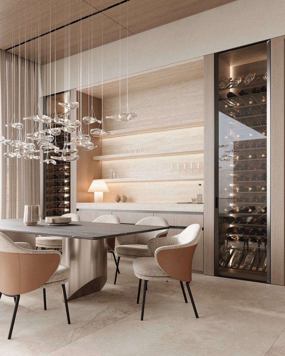 SenceArchitects's tweet photo. The dining room is adorned with exquisite veneered wood fronts and natural travertine stone. The dark marble table creates a striking contrast against the sandy color palette that encompasses the entire dining area. #interiordesign #architecture https://t.co/pt3QqLTFcW https://t.co/oos9aypq41