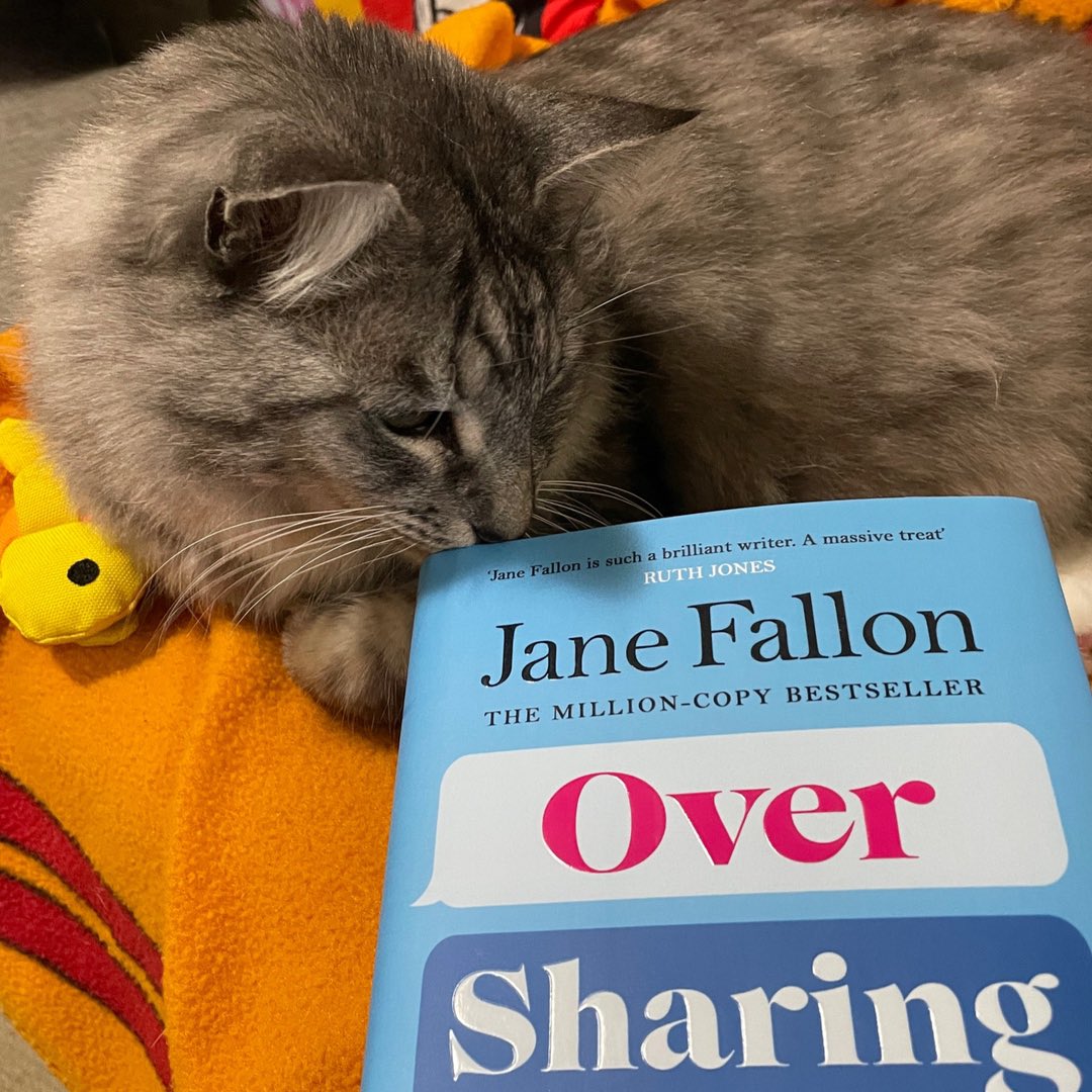 ClaireComedy's tweet photo. Yippee!! My signed copy of lovely @JaneFallon’s latest smash hit #OverSharing made it to Sydney, thanks to the fab people at @WELBooks. Piper is doing his best to join the #PromoPet parade. 😀📚😻 https://t.co/NtE060vcen