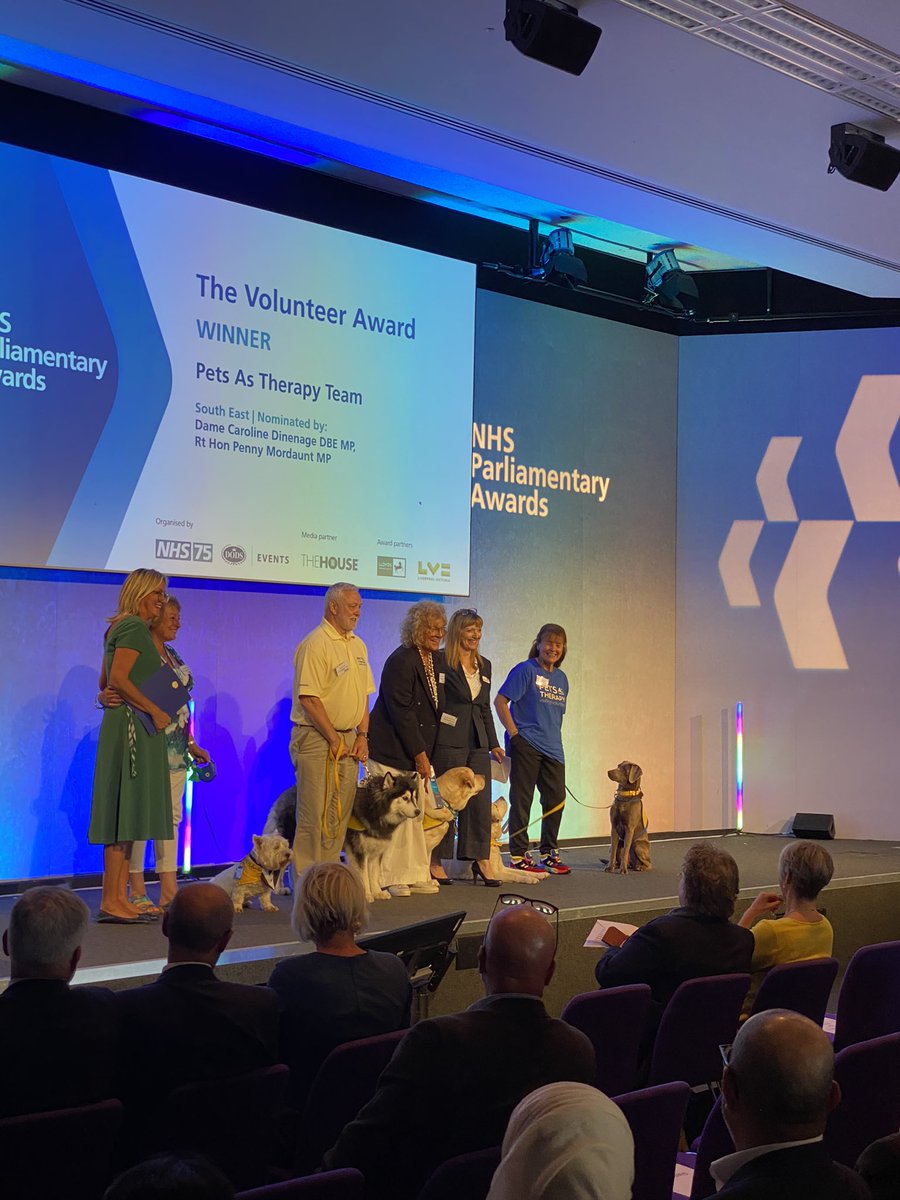 VoluntaryPHU's tweet photo. They did it!! 🐶 

Our INCREDIBLE @PetsAsTherapyUK Teams have WON the Volunteer or the Year awards! 🏆 

In a room full of dog loving fans, they gained the biggest apPAWs of the day.

We are honestly so thrilled and grateful for the amazing work they do! 
#NHSParlyAwards https://t.co/gjnnvNo1wB