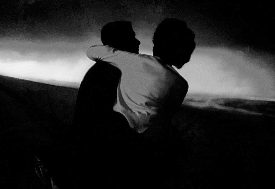 Lovers on the beach in the evening By Frank Horvat