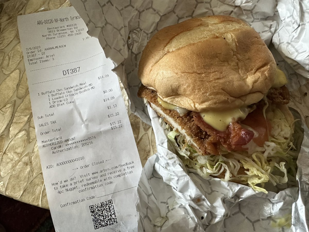 lindseycore's tweet photo. @Arbys  @ArbysCares  just ordered and paid for a Buffalo chicken sandwich and loaded fries and this is all I got. A sad looking chicken bacon Swiss with part of the chicken cut off?? Tried to call the store and it goes straight to a voice mailbox setup. Please help. https://t.co/koPZwnwWSG