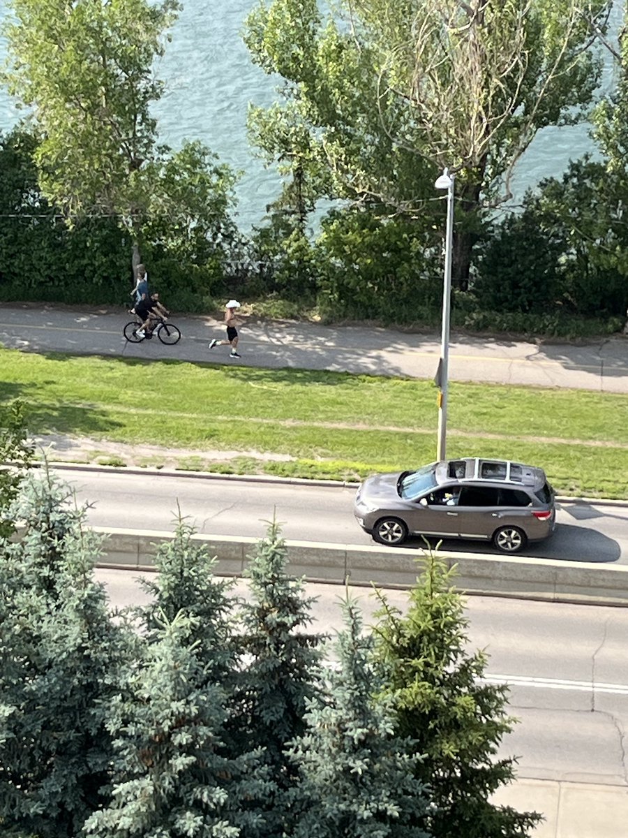 Only in #Calgary do you see a guy running with his shirt off and a cowboy hat on. Almost #Stampede time…