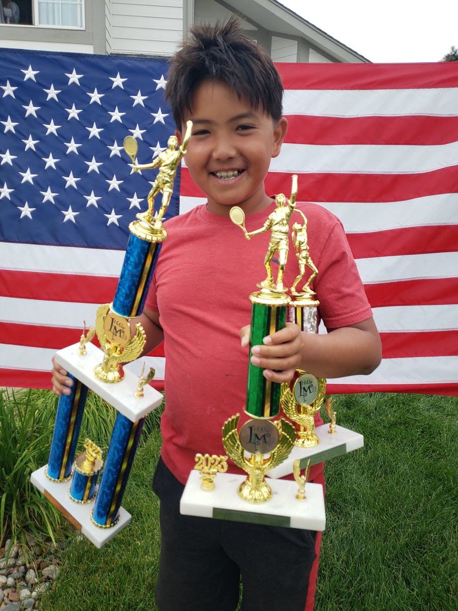 mcbtennis's tweet photo. Big smile for some big trophies. Happy Fourth of July from Mathias! https://t.co/zm8wUp7r73