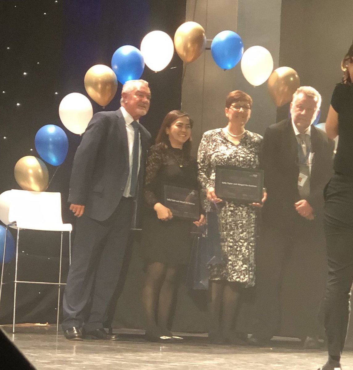 The winners of the Enhancing Patient Safety Award are Sally Tipler and Abigail De Guzman, Venesection Nurses at #ConquestHospital. “They have transformed the way haematomachrosis patients keep a record of their care.” #TrustAwards