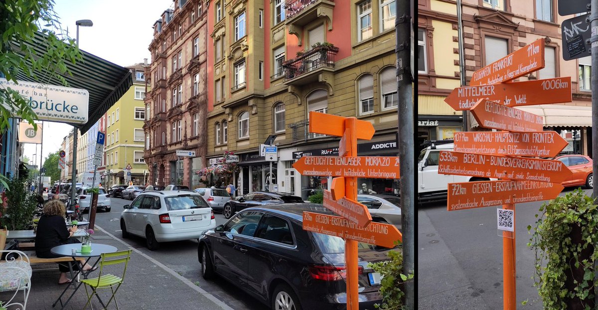 Zwei Fotos nebeneinander montiert</p><p>linkes Foto:<br>Vor der café bar 'Die Brücke' in der Brückenstraße in Frankfurt Sachsenhausen steht ein oranger Pfahl mit mehreren orangen Wegweisern. Über Tischgruppen auf dem Bürgersteig ragt das Café-Schild ins Bild.</p><p>rechtes Foto:<br>Detail des Pfahls mit den orangenen Wegweisern: Flughafen Frankfurt / Mittelmeer / Geflüchtetenlager Moria2.0 / Warschau, Hauptsitz von Frontex / Berlin, Verkehrsministerium / Gießen Erstaufnahmeeinrichtung