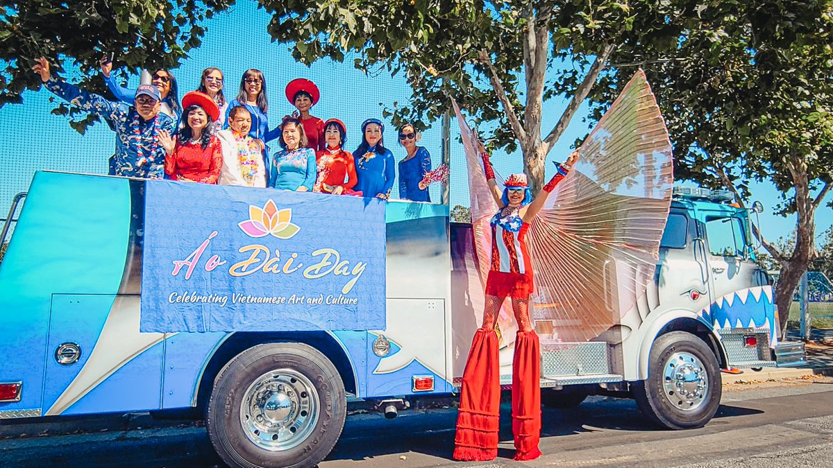 SJFD's tweet photo. We had a great time at yesterday's 'Rose, White &amp; Blue Parade!' #SJFD's Shark Engine rode with &amp; alongside the Ao Dai Festival team in celebration of diversity &amp; inclusion in #SanJose. @FriendsOfHue @RWB_Parade https://t.co/8E7kKfpN5e