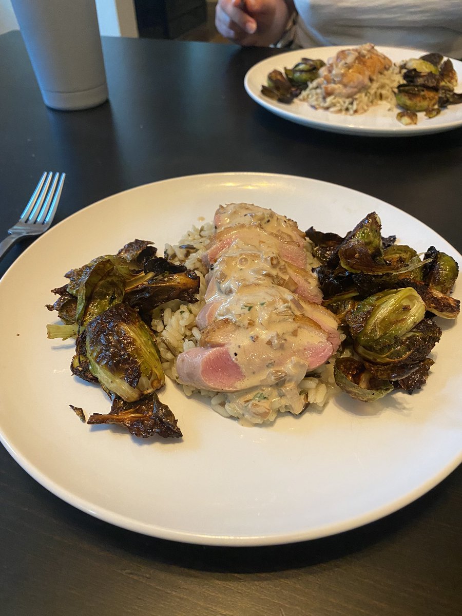 KeenanIrish's tweet photo. Tonight the chef is serving a pan seared duck breast with a cognac pepper cream sauce. That is all served over a bed of wild long grain rice along with a side of oven roasted Brussel sprouts tossed in a balsamic reduction https://t.co/bJYT5gbf58