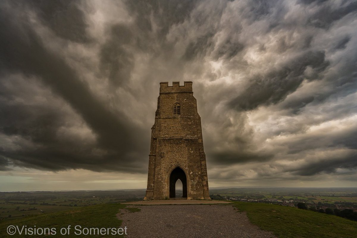 Glastomichelle's tweet photo. Threatening clouds on Glastonbury Tor. https://t.co/1FjMD4EMMC