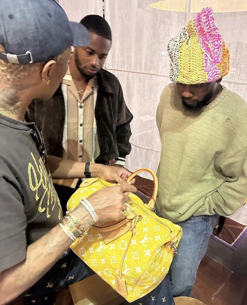 garçon on X: Pharrell showing off the million dollar LV bag to