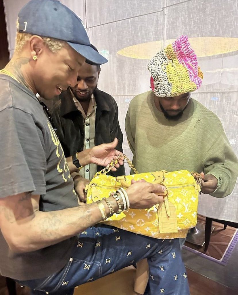 garçon on X: Pharrell showing off the million dollar LV bag to Dave and K.  ✨  / X