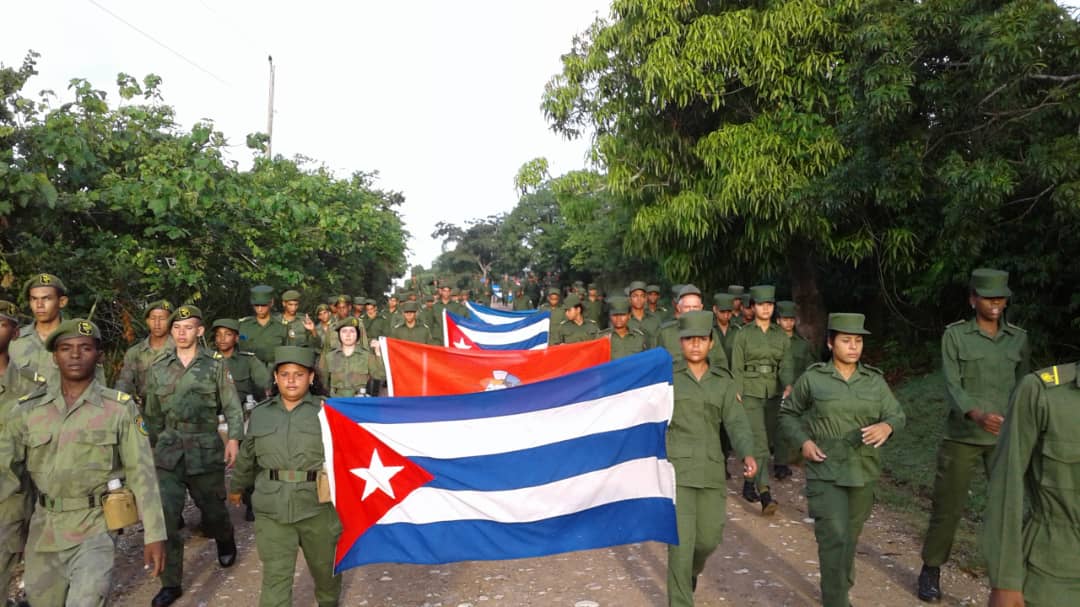MinfarC's tweet photo. Los oficiales y cadetes de la Escuela Interarmas José Maceo, honran al León de Oriente con una marcha patriótica hasta Loma del Gato.
Las nuevas generaciones no fallarán.
#CubaViveEnSuHistoria https://t.co/YN53dT9d7a
