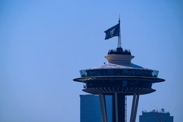 Wide shot of the Space Needle with the All-Star Game flag. 