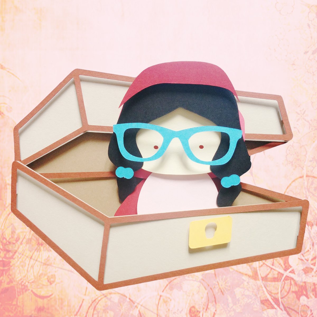 The general logo I've been using for years.

It's a portrait of me using my Kokeshi style, put together using my papercut technique. The box is a nod to series of cosplays I use to do from Rozen Maiden, where I would tuck myself into a lifesize doll case,.