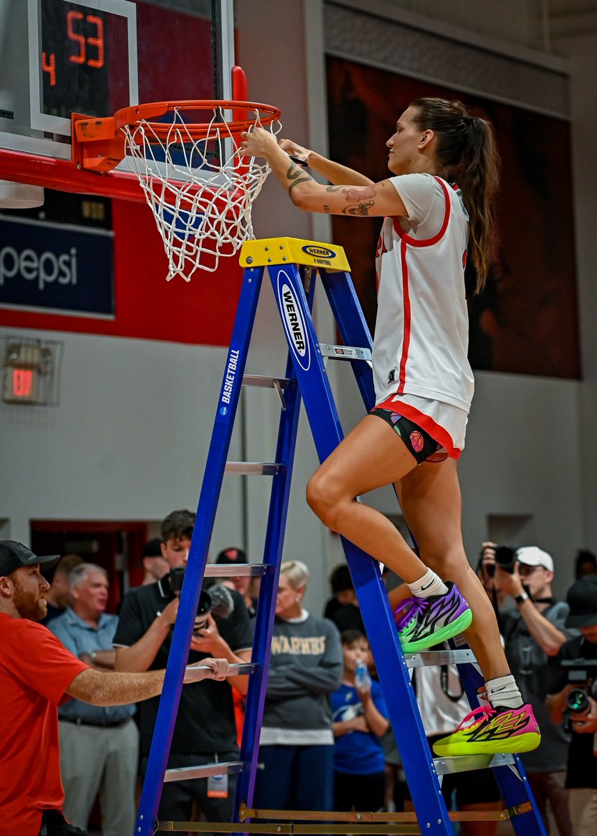 UTampaWBB's tweet photo. All-American center Sydney Kin will forever be etched in the glass on one of the most prestigious walls in the Martínez Center and will go on to be one of greatest players to tug on a Tampa jersey! https://t.co/NcW4ggB8mk