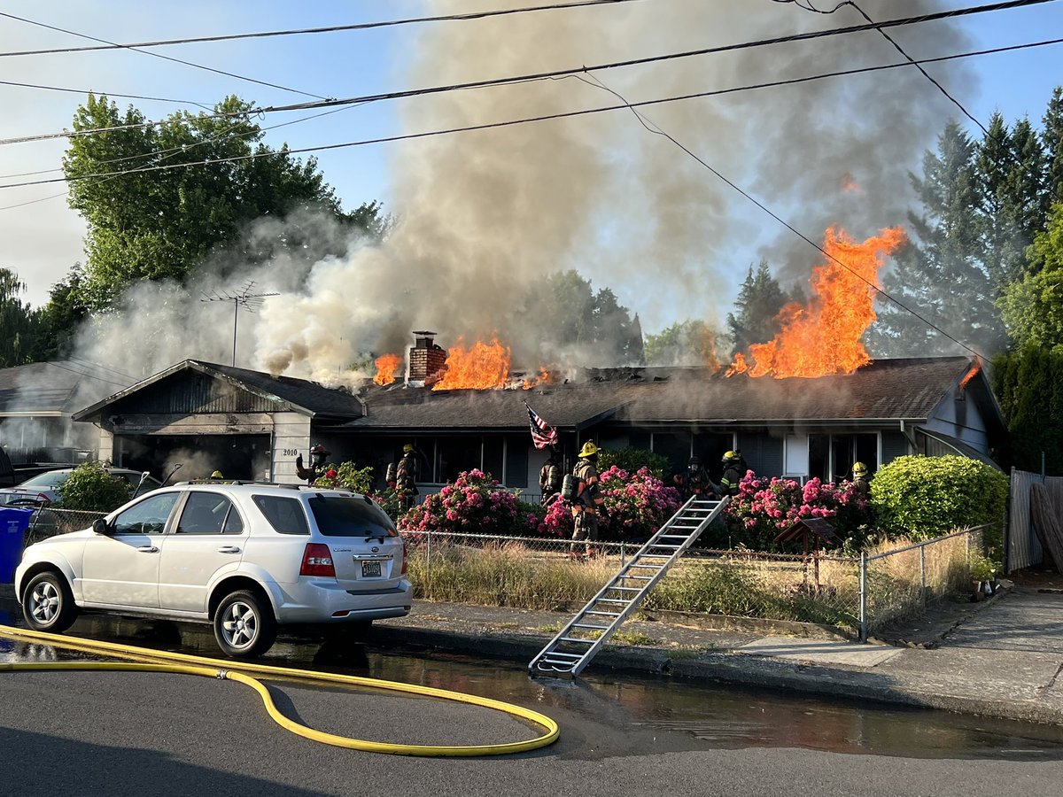 KGWphotog's tweet photo. A couple and 3 dogs escape a house fire in NW Gresham. A female was transported to the hospital, according to a neighbor who shared these photos of the flames. She held onto one of the dogs who walked out of the home as firefighters arrived. @KGWNews #greshamfire #Gresham https://t.co/nebDlumZMu