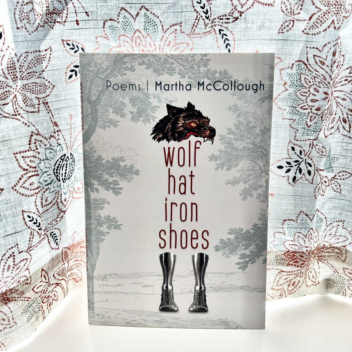 Summer reading: WOLF HAT IRON SHOES by Martha McCollough (Lily Poetry Review Books, 2022), a book of owls, insects, black apples, myths, moons, strangeness, wolves, plague, imagination, coins, bees, flame, time, and space. ♥️ @PoetryLily