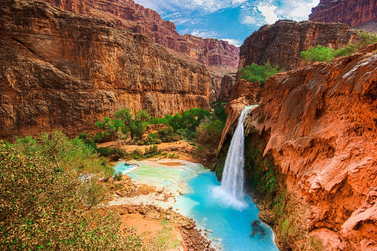 Havasu Falls, a 19.2 mile round trip and 3100+ drop into the Grand Canyon, is a top bucket list for every adventurer! Due to the popularity and conservation of the area, a 'hard to get' permit from the Havasupai Indian Reservation is required. #grandcanyon #HavasuFalls