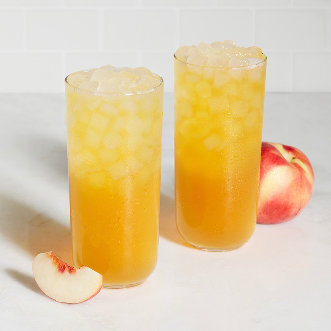 Sip into summertime with the White Peach Sunjoy, a refreshing combination of our classic Lemonade and freshly-brewed Iced Tea blended with white peach flavors. 😎 Available for a limited time.