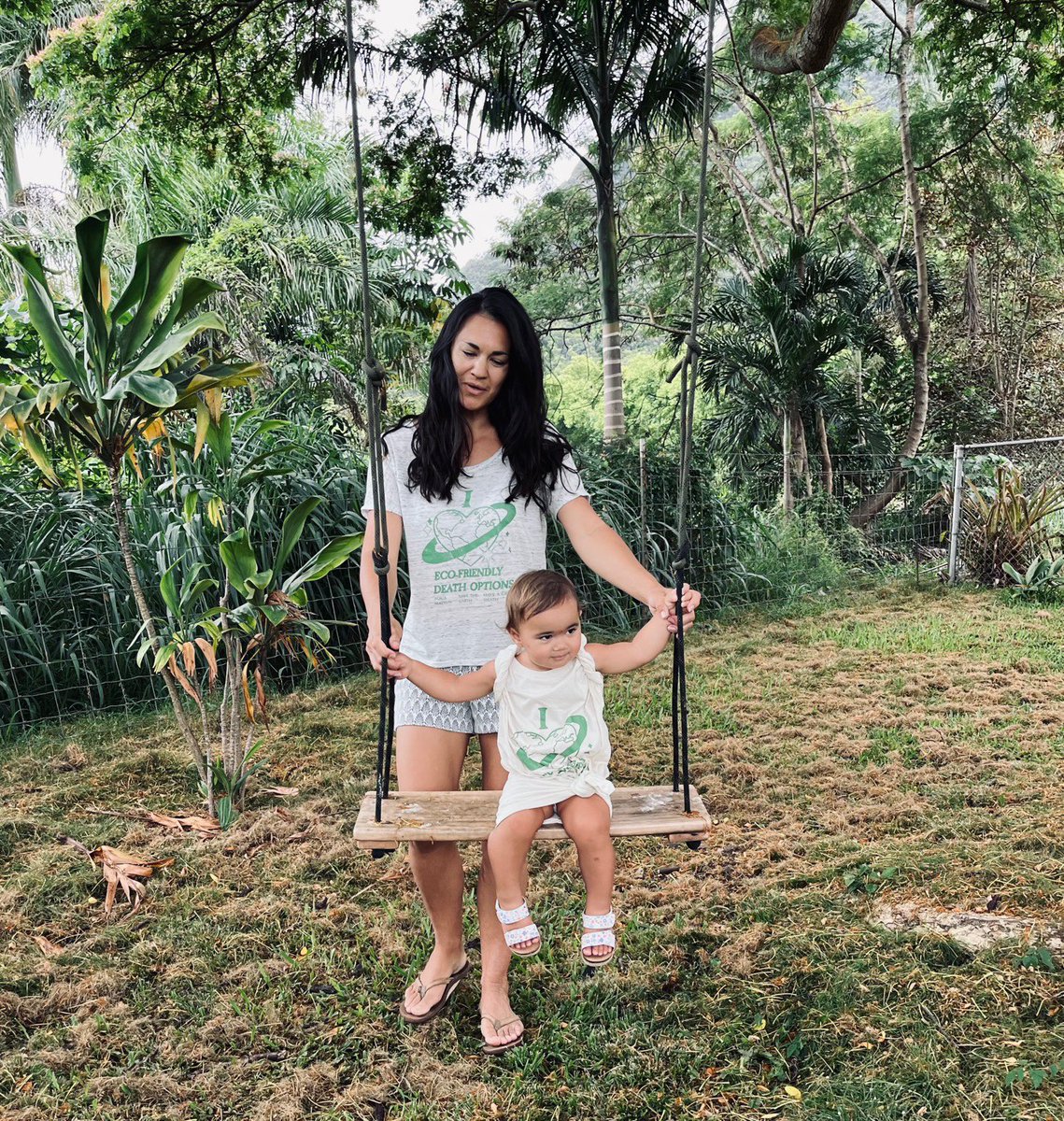 OrderGoodDeath's tweet photo. Cortney and the youngest Pāhiki team member Taika, are wearing our I 💚 eco-friendly death options design, which is part of our Eco-Death Nostalgia Collection. Get yours here: 
https://t.co/D3Sjp7PcZo https://t.co/Myo642s5r9