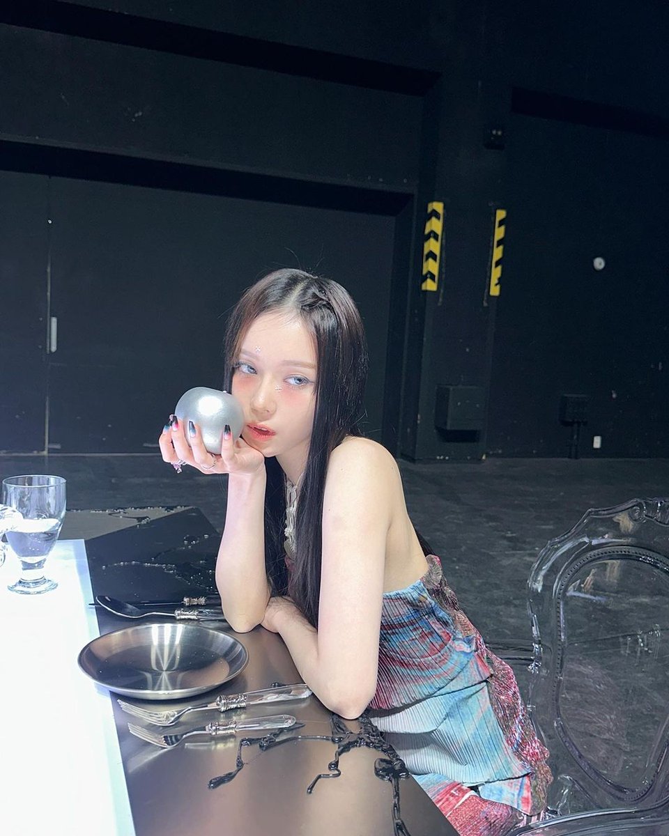 The silver fruit. I'm holding the apple in my hand. As Snow White would taste the fruit of her stepmother's poison.