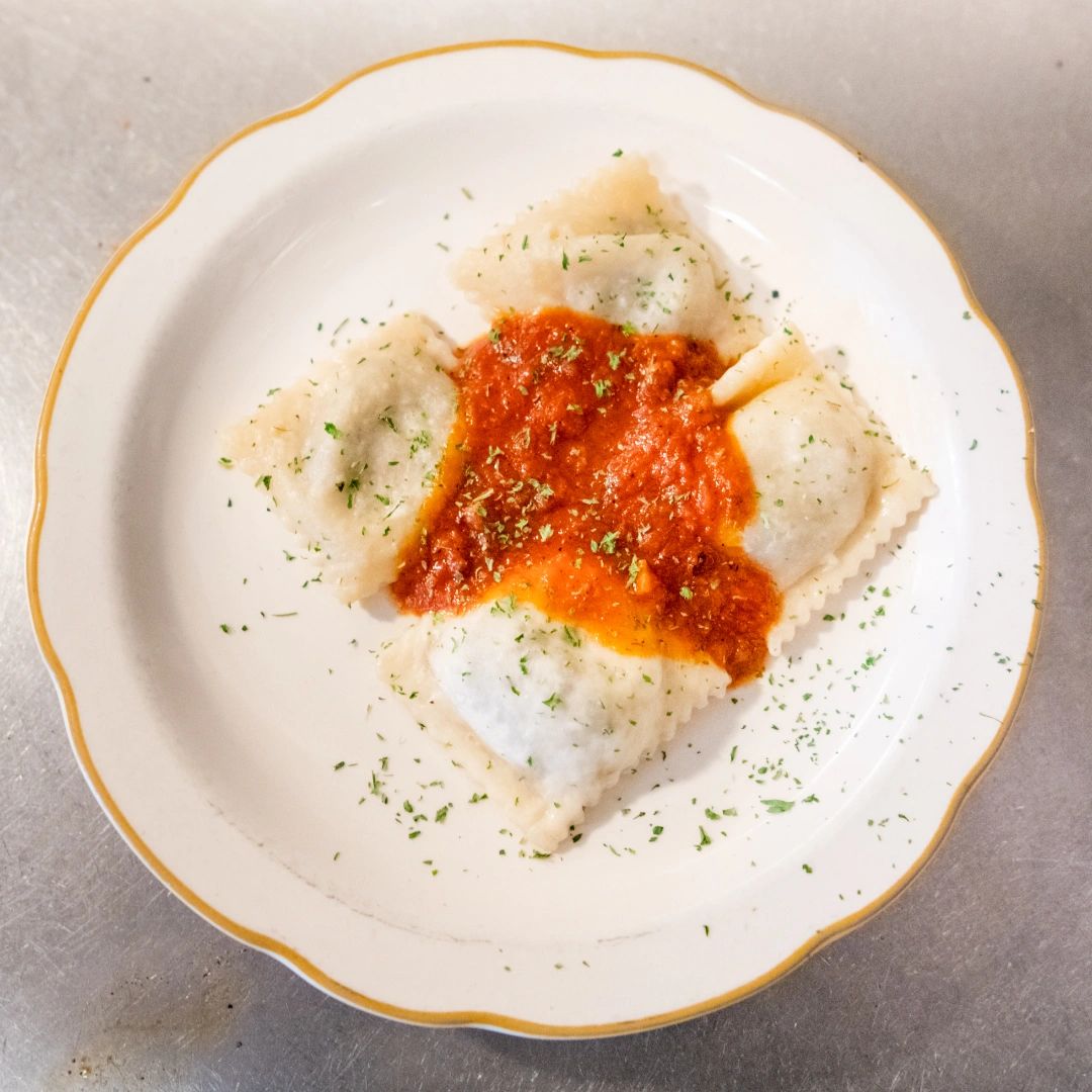 At Napoli Pizzeria, we're not just about pizza. Our menu features an array of delectable Italian dishes, including savory calzones and flavorful ravioli. Step into a world of authentic flavors and indulge in Italian culinary delights. #ItalianFood #NapoliPizzeria