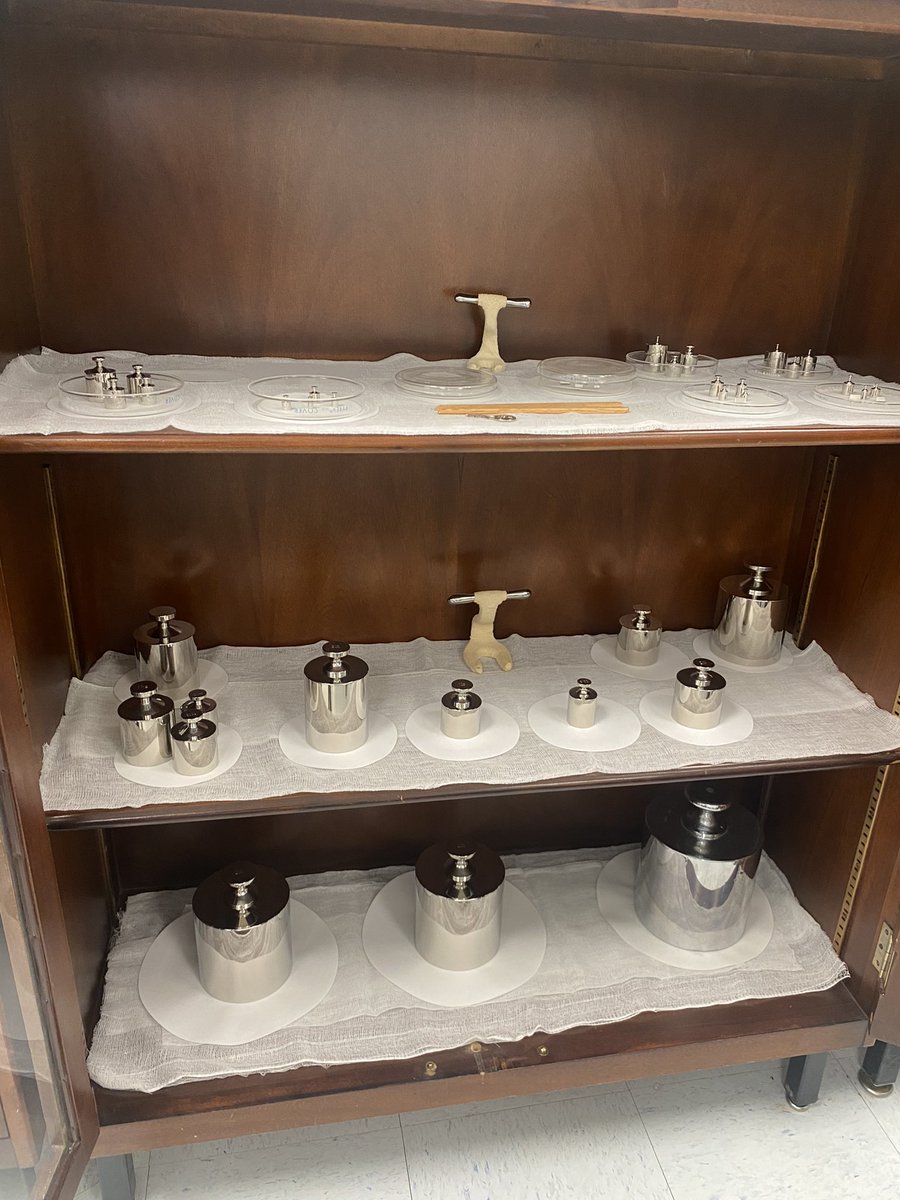 RyanQuarlesKY's tweet photo. Under lock and key are the official weights &amp; measures of our Commonwealth! Here lies the official 1 pound weight of Kentucky, in which all other scales are calibrated against. It’s so sensitive only medical gloves may be used on it. I’m holding the official half bushel and pint. https://t.co/chUjU0KbZY