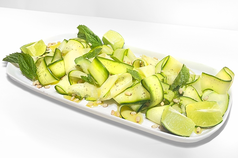 Our Summer Squash Carpaccio recipe features thinly sliced squash that's delicately dressed with mint, lime, and salty Pecorino cheese. Get the recipe at bit.ly/3rh8IjIo and experience a dish you'll be making all summer long.