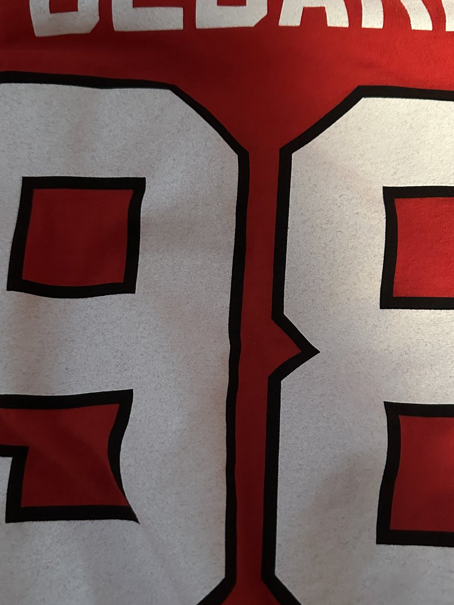 Jermm1988's tweet photo. @Fanatics @FansAuthentic I just recently purchased Connor Bedard Blackhawks Shirts. The red after 1 wash(Inside out and hang dried) The numbers and letters are ruined. Also the the logo is slightly crooked. Never seen such poor quality shirts before. https://t.co/yslIEX3h1i