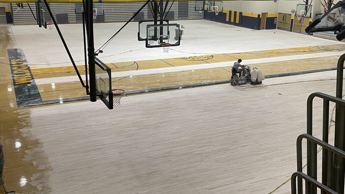 NeuquaValley's tweet photo. Significant improvements to The Main Gym began today. It is being fully sanded down, then refinished and repainted with new stain and updated graphics. https://t.co/XhCIj7d8Jn