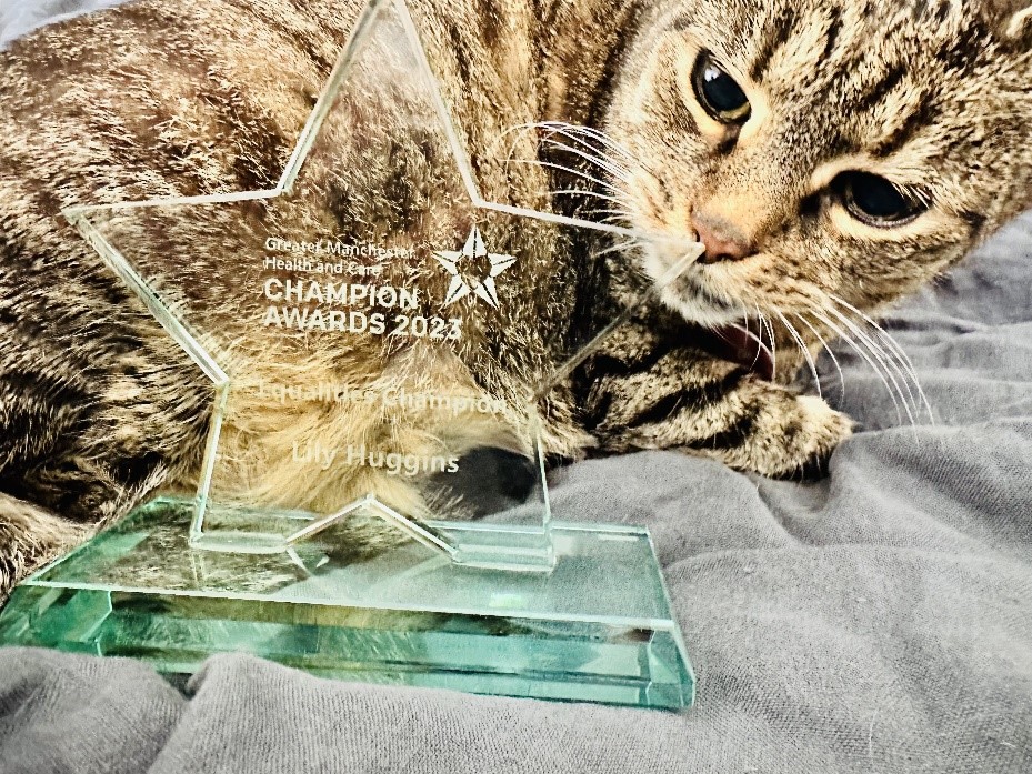 Unfortunately, our #EqualitiesChampion Lily was unable to attend the @GMchampions2023 awards last night.

However, we are delighted to say that our Deputy Chief Executive @benwhalley114's beloved 'Mrs Cat' is doing a great job in keeping it safe until it’s in Lily’s hands 🐱