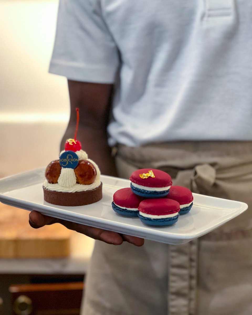 Happy #BastilleDay 🇫🇷 ! To celebrate we have a Cherry St Honoré with chocolate chip cream and meringue, cherry insert and finished off with vanilla Chantilly, and vanilla and cherry macaroons available today only from 11 am!