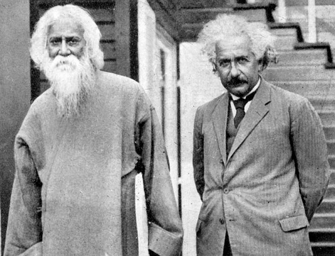 Albert Einstein and Rabindranath Tagore at his home in the outskirts of Berlin in 1930. They are standing next to each other. 