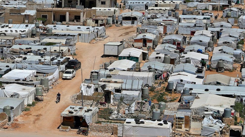 The difference between a palestinian refugee camp in and a syrian refugee camp both are in lebanon The white tents is for the syrian The other one is for the palestinian