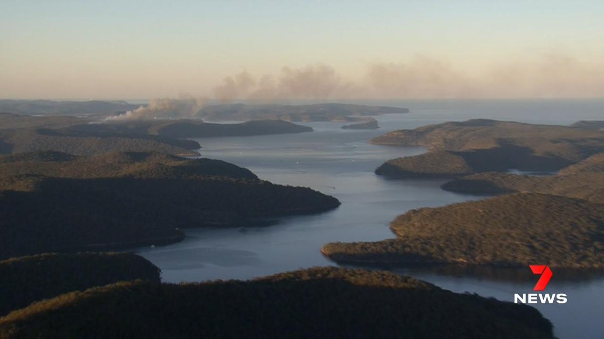 7NewsSydney's tweet photo. Our helicopter flew past the burn at about 4:30pm today, and captured these images showing the smoke moving across the Hawkesbury River into Broken Bay near Lion Island and Palm Beach. https://t.co/TWh1KQh9q4 #Patonga #NSWfires #7NEWS https://t.co/KzH4aFOi9B