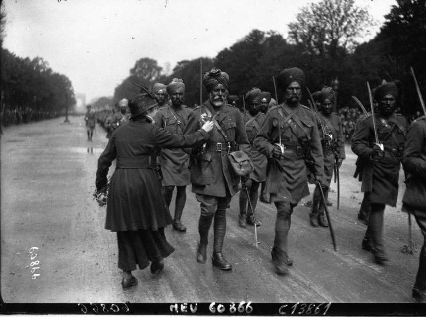 sidhant's tweet photo. Indian soldiers at Champs-Élysées at the military parade of July 14, 1916. At the time this snapshot, the Battle of the Somme, in which the Indian Expeditionary Force (IEF) were fighting, had already begun. This was given as a gift by Prez Macron to PM Modi. https://t.co/26ZtPty9s6