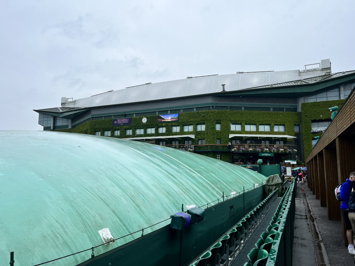 Dodging the raindrops under the #1 Court roof <a href="/Wimbledon/">Wimbledon</a>