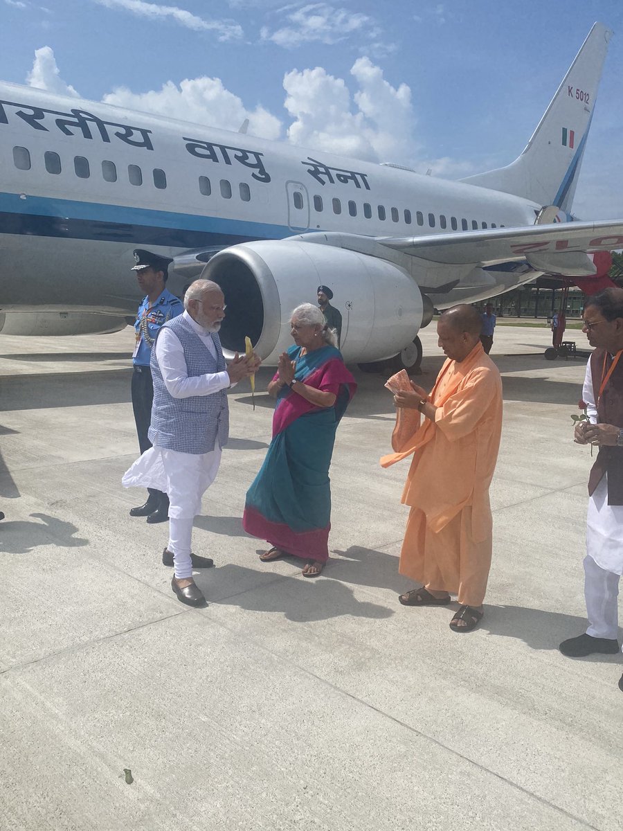 PMOIndia's tweet photo. PM @narendramodi was welcomed by Governor @anandibenpatel, CM @myogiadityanath and other dignitaries on his arrival at Gorakhpur. https://t.co/LoQ0J2MGrJ