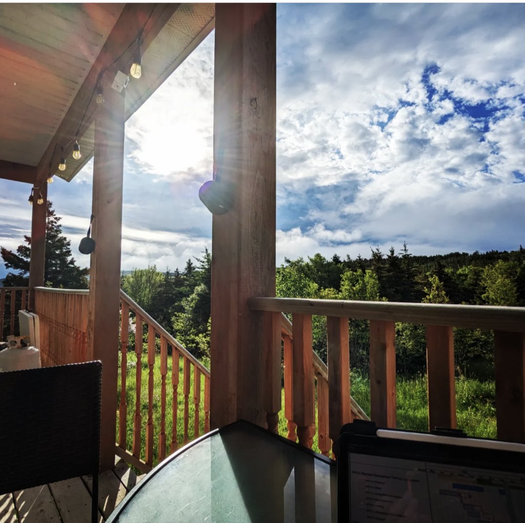 mcumby's tweet photo. While I love being in the office team environment, flexible work life is a great benefit. What a great way to start a Friday work day! Morning sun on my face, my coffee in a new #redmug ! #worklifebalance #cabinlife #summerNL https://t.co/j5p7oP9eW0