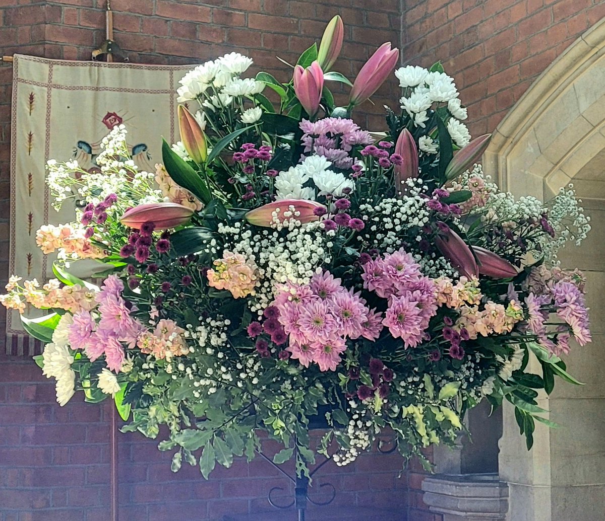 Fresh flowers in church today. As ever the photos don't do them justice, and the lilies are only just beginning to open.