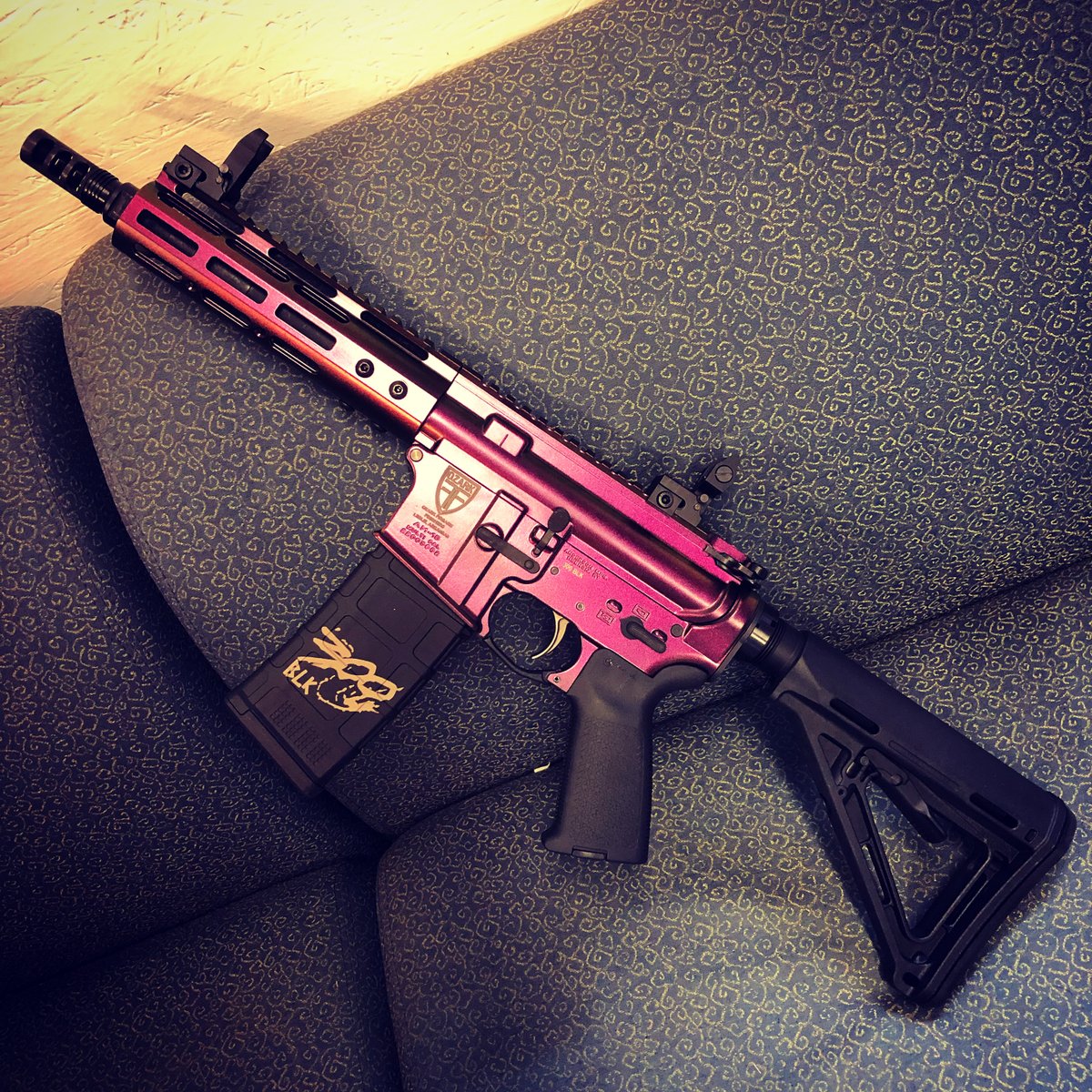 OzarkFirearm's tweet photo. The couch is ugly, but the gun is pretty. .300 AAC Blackout SBR in #GunCandy Razorback finish. https://t.co/ljaRxKqXok