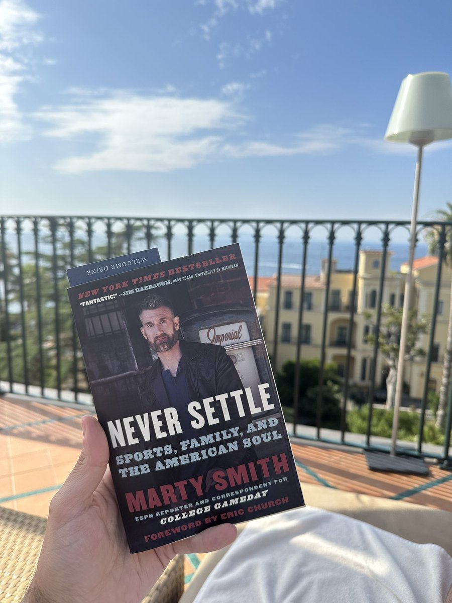 Summer reading - Never Settle by <a href="/MartySmithESPN/">Marty Smith</a> - live from Sorrento Italy - figured I would read since I can’t get <a href="/MartySmithESPN/">Marty Smith</a> and <a href="/ESPNMcGee/">Ryan McGee</a> on the radio in Italy!  Highly Recommend.