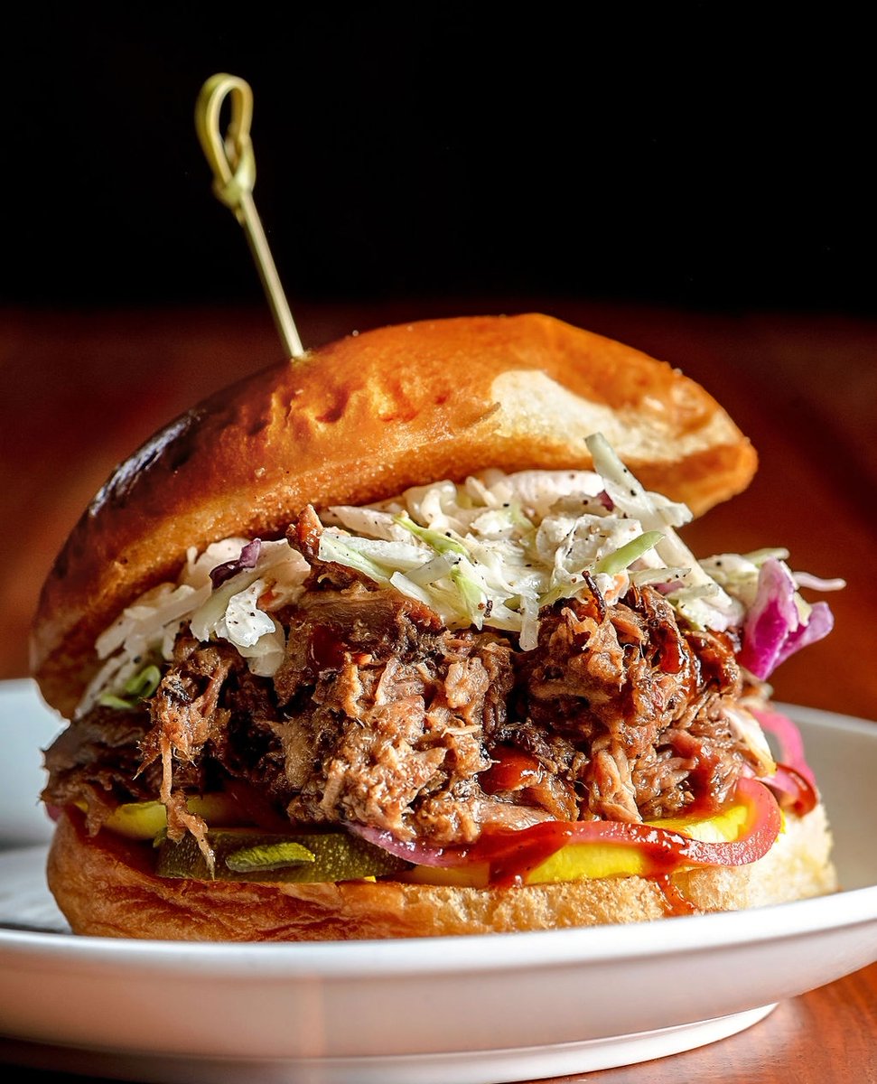 Sink your teeth into our juicy Carolina Pulled Pork Sandwich loaded with tender pork, sweet zucchini pickles, &amp; our homemade North Carolina BBQ Sauce.🔥

Click the link in our bio to order online!

📸: @esculentbymsp