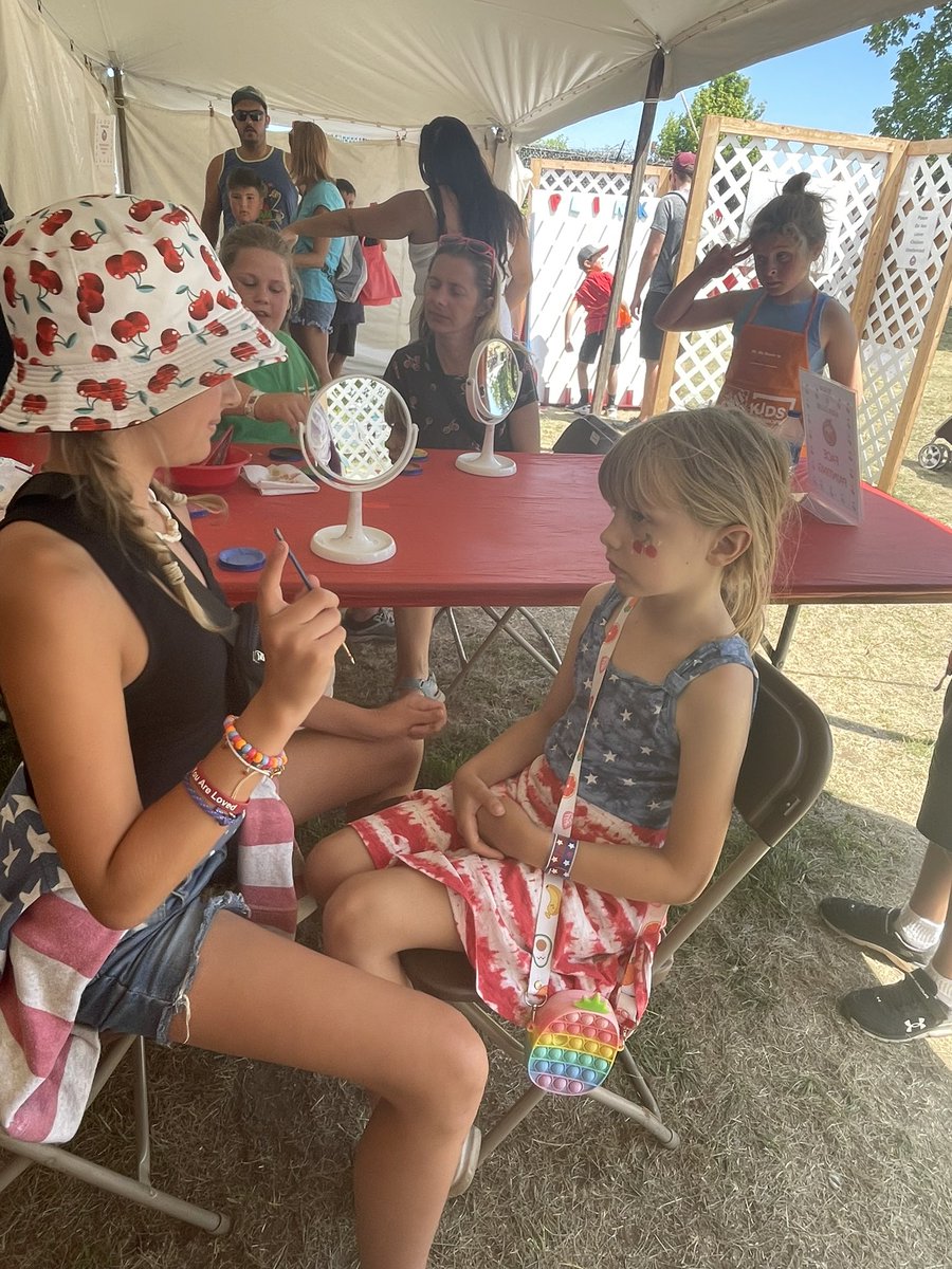 DrCathyNMC's tweet photo. National Cherry Festival - kid’s corner face painting.  Love these volunteers.  And Cora loves her cherries and fireworks. https://t.co/G4LxGSm7Hg