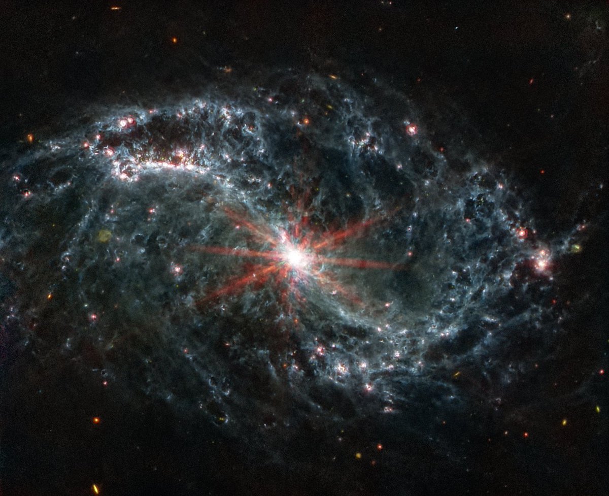NASAWebb's tweet photo. This piece by Adam Maxwell reminds us of Webb's mid-infrared view of NGC 7496!

At the center of this barred spiral galaxy is an active supermassive black hole emitting jets and winds. NGC 7496 lies over 24 million light-years away from Earth: https://t.co/5IIbgV3UPt https://t.co/NdmCQoqlxw